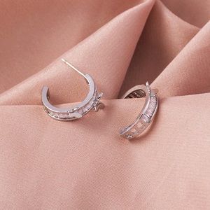 Butterfly c-shaped silver copper hoop earrings.
